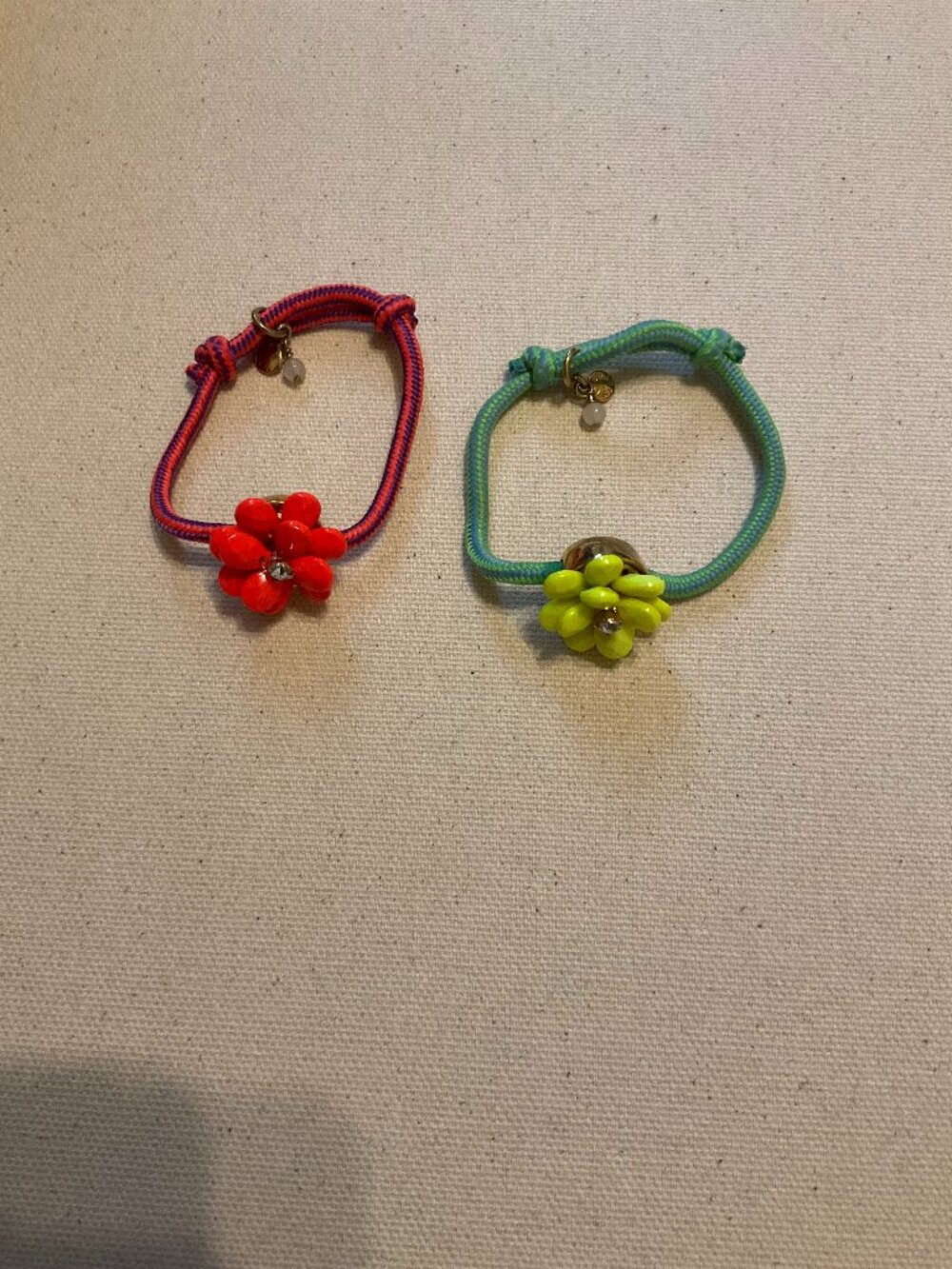 J.CREW CREWCUTS SET OF 2 CORD FLOWERS BRACELETS. COLOR: RED, GREEN.